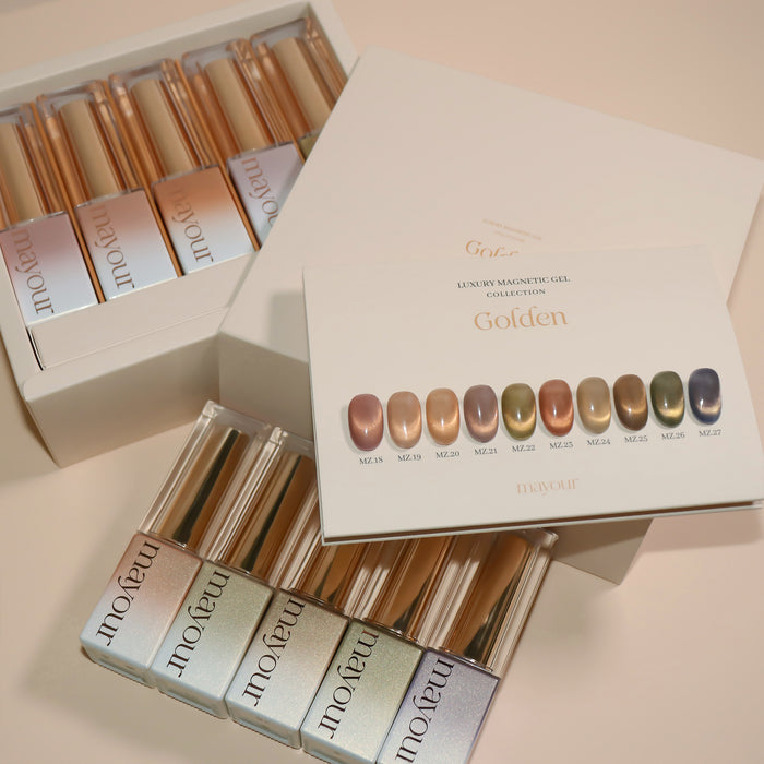 Sophisticated display of MAYOUR's Golden Collection magnetic gel polishes, showcasing an array of luxurious, warm-toned shades perfect for creating dynamic, multi-dimensional nail art. The elegant packaging and product details highlight the brand's commitment to quality, style, and performance.