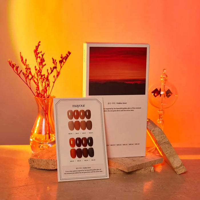 Vibrant nail polish collection capturing the golden hour beauty, featuring a swatch card and warm-toned product packaging, creating an elegant and captivating display for the MAYOUR brand.