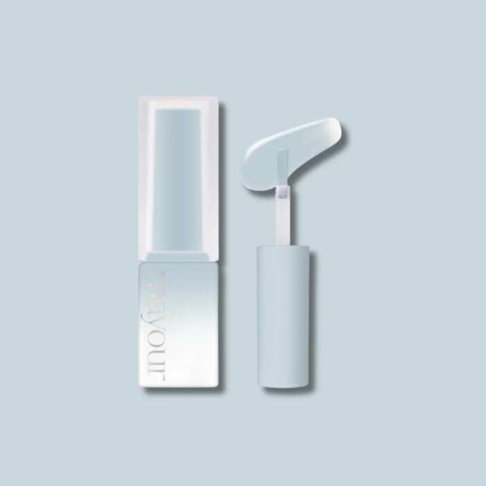 A minimalist image of a white nail polish bottle and applicator, showcasing the elegant MAYOUR Grooming Collection product with its soft pastel color and user-friendly design. This premium grooming set offers versatile application, a quick-drying formula, and generous volume to transform nails effortlessly and exude the essence of spring.