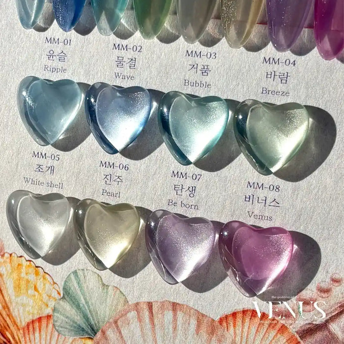 The alt text for this image of the "MAYO Venus Collection 8pcs/Set" Shopify product could be:

"This image showcases the MAYO Venus Collection, a set of 8 soft and silky magnetic gels inspired by the goddess of love. The gels feature fine glittering particles that create a satin-like finish. The set includes a variety of shades and shapes, such as ripples, waves, bubbles, and heart-shaped designs in colors like blue, green, white, and purple.