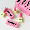 A promotional image showcasing Yummy Art Matte Top Gel bottles arranged in a visually appealing pattern against a background of pink boxes labeled 'YUMMY.' The vibrant colors of the packaging highlight the product's branding.