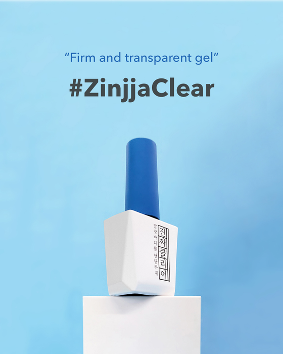 Mostive Jinzza Clear Top Gel bottle on white pedestal against blue background, showcasing firm and transparent gel product. Text highlights its clarity and firmness. Premium German-sourced ingredients for long-lasting, glass-like shine without yellowing or heating required.