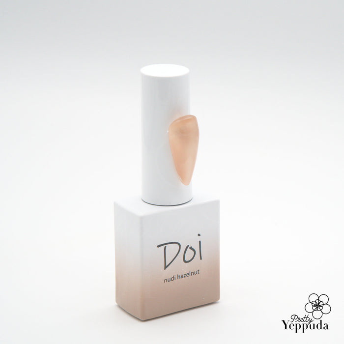 Elegant and chic Nailbayo DOI Nudi Gel in Hazelnut hue, a versatile Korean nail product designed for professionals and beginners alike. Its syrup-like formula provides excellent coverage and self-leveling properties, making it the perfect base color for any nail art design. Shopify, Nailbayo, DOI.