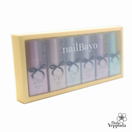 Nailbayo DOI Sugar Magnet Gel Collection in a sleek yellow box, showcasing six pastel-colored nail polish bottles with elegant bow designs. The set features a range of soft, iridescent hues perfect for creating stunning magnetic nail art effects. Premium Korean nail supply for professional-quality manicures at home.