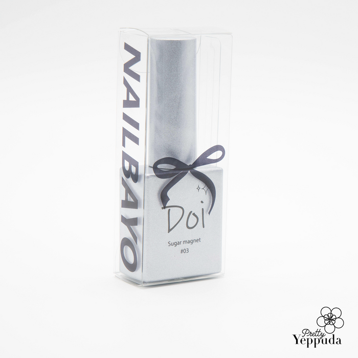 Elegant white packaging of Nailbayo DOI Sugar Magnet Gel, featuring a sleek rectangular bottle with purple text and a delicate bow. The product name and "Sugar magnet" are visible, showcasing the Korean nail supply's premium quality and sophisticated design for magnetic nail art enthusiasts.