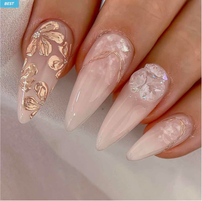 Elaborative alt text: Striking and glamorous nail art showcasing the Nailbayo Doi Tong Gel #3 product. The nails feature a mix of neutral tones and shimmering gold floral designs, creating an elegant and eye-catching look. The Nailbayo brand's signature high-quality gel formula and innovative nail art designs are beautifully displayed, highlighting the brand's Korean nail supply expertise and the talented NAILBAYO nail artist behind this stunning