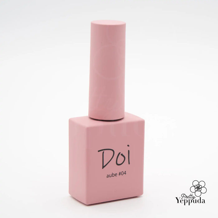 Visually appealing, high-quality gel nail polish bottle with the brand name "Doi" and the product name "Aube #04" prominently displayed. The sleek, minimalist design and soft pink color create an elegant and sophisticated aesthetic, highlighting the premium nature of this Korean nail care product. This alt text aligns with the Shopify product description, promoting the brand's reputation and the specialized expertise of the Korean nail artist beh