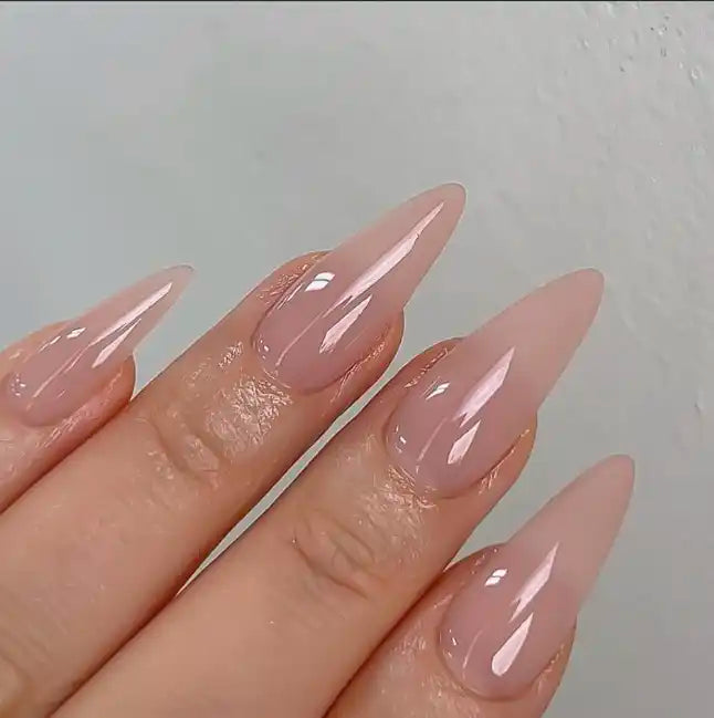 Buildable, syrupy gel nail polish in a nude, flesh-toned hue with a glossy, self-leveling finish. Ideal for creating a natural, minimalist manicure or serving as a versatile base for elaborate nail art designs. The Nailbayo DOI Nudi Gel Skin product provides excellent coverage and easy application, making it a great choice for both beginner and experienced nail enthusiasts.