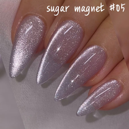 Dazzling sugar magnet gel nail polish set by NAILBAYO, a renowned Korean nail artist, showcasing captivating silver glitter effect for a sophisticated, eye-catching manicure. The product requires a specialized magnet stick for optimal application and magnetic nail art design.