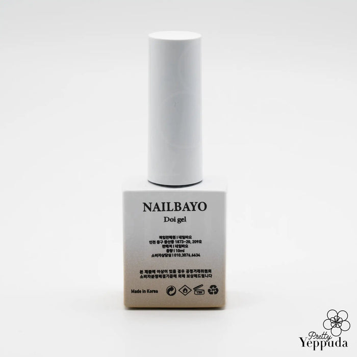 Elaborative alt text for the Nailbayo DOI Nudi Gel Birch - 10ml product image: A white cylindrical bottle with the Nailbayo brand name prominently displayed, showcasing the Korean nail supply brand's Doi Nudi syrup gel in a birch color. The product features a buildable, self-leveling formula that is easy to apply for both professionals and beginners, making it the perfect base color for various nail art designs.