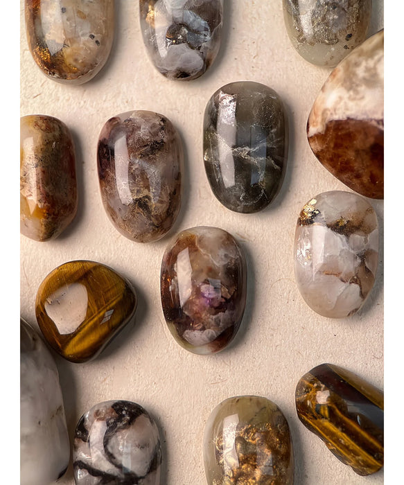 Gemstones in natural colors and textures, showcasing the beauty and elegance of various mineral formations. This image could be used as an alt text for a Shopify product featuring the BEVLAH Tutorial Vol. I Gemstone Collection, highlighting the stunning gemstone-inspired designs that can be achieved with the comprehensive kit.