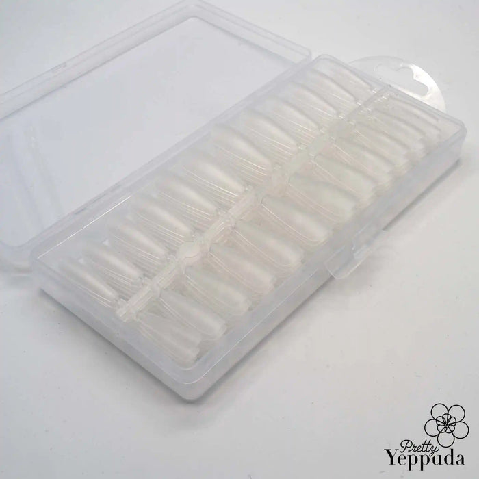 Detailed, high-quality image of a Shopify product titled "Pretty Yeppuda Full Cover Coffin Tips" containing 240 clear stiletto nail tips, showcasing the brand's premium nail care offerings.