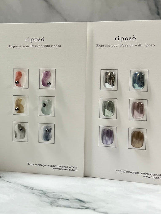 A diverse collection of muted ink colors from the RIPOSO brand, showcasing their range of nuanced shades suitable for a variety of artistic and design applications.