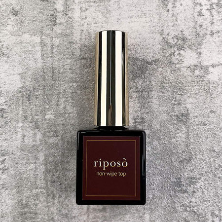 Elegant and long-lasting base gel for Shopify RIPOSO Non-Wipe Top, designed to adhere closely to nails without excess pressure, offering enhanced hardness and retention even on thin nails. Formulated to prevent pinholes and cratering while ensuring a smooth application with a perfect cure time.