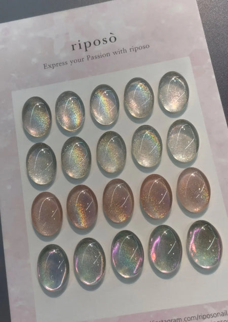 The image shows a collection of holographic magnetic gel bottles, showcasing the vivid, shimmering hues and varied holographic effects of the Riposo HO-02 product. The image highlights the unique, visually striking nature of the holographic gel, which can create a range of mesmerizing holographic displays depending on the lighting conditions. This detailed alt text captures the essence of the product's captivating visual appeal and the brand's em