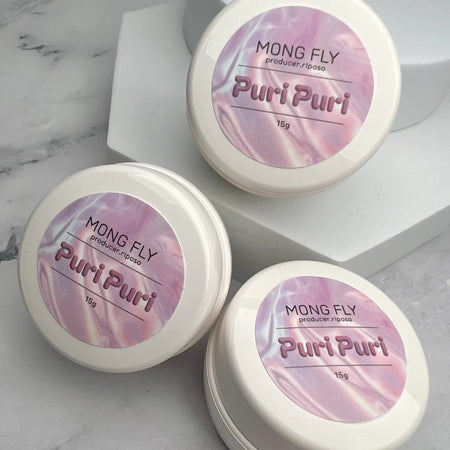 The alt text for this Shopify product image of "RIPOSO Puri Puri 3D Art 15g" could be: "Three jars of Mong Fly Puri Puri gel product, featuring the brand name and product name prominently displayed on the labels against a pink and white marble background.