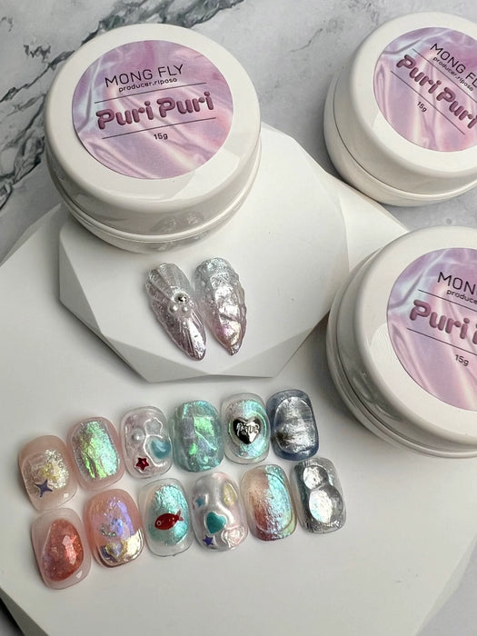 Puri Puri 3D Art Gel by MONG FLY: A versatile and innovative nail art gel that allows for the creation of sculpted, ripple designs. Its excellent adhesion and firm texture make it suitable for securely fixing nail charms and extensions, providing a strong and durable solution for various nail enhancement needs.