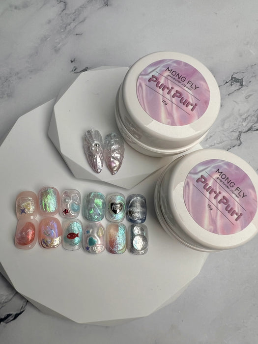 Decorative 3D nail art gel in jars, showcasing the "RIPOSO Puri Puri" brand name and a variety of colorful, glittery nail art designs.