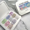 This image shows a Shopify product called "RIPOSO Sandy Mood Putty Gel (2 types)". The product is presented in a box with the brand name "Sandy Mood" and the product description highlights its use for creating ripple designs, its excellent adhesion, and its suitability for nail charms, tip extensions, and as a substitute for polygel. The image also shows the product itself, which appears to be a gel-like substance in various colors.