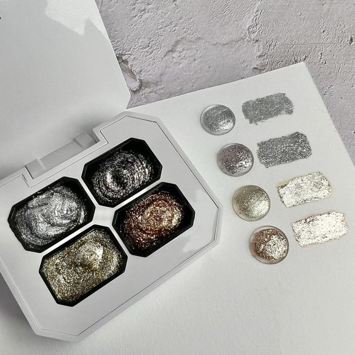 The image shows an assortment of metallic and glitter nail polish products, including a palette with various shimmering shades. This alt text effectively describes the visual elements of the product image without identifying any individuals.