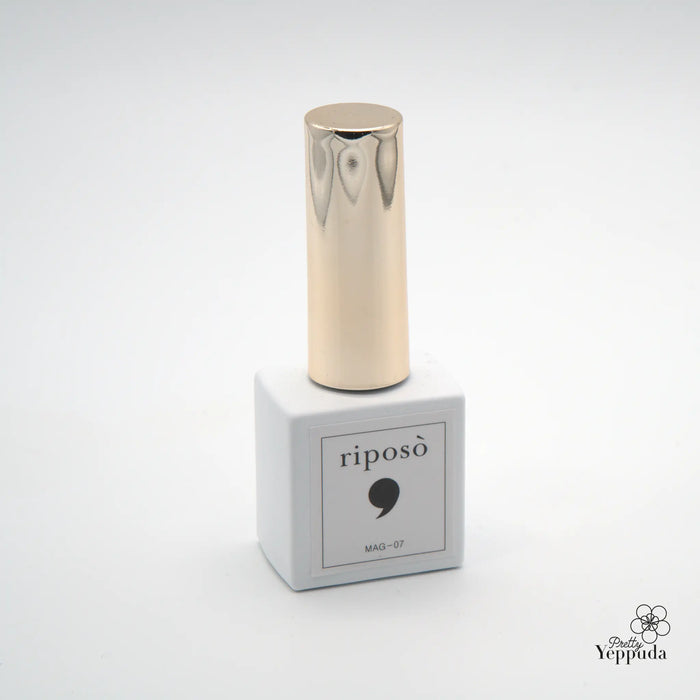 A close-up image of a glass bottle containing the Shopify product "RIPOSO Pulling Summer" - a 10-pack of unique, iridescent magnet gel polishes with a brilliant, natural eye-catching effect that only requires one coat for full coverage. The product showcases Shopify's innovative beauty and cosmetics offerings, highlighting its commitment to high-quality, eye-catching products.