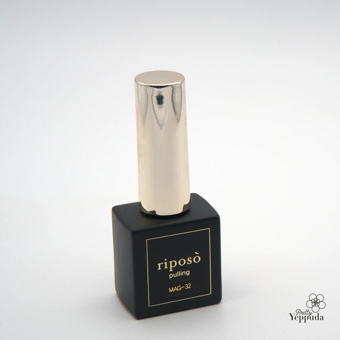 A sleek, metallic nail polish bottle in a pastel color, part of the Riposo Pulling Gleam C collection, showcases a delicately sparkling, wipe-type magnet gel formula perfect for the upcoming spring season.