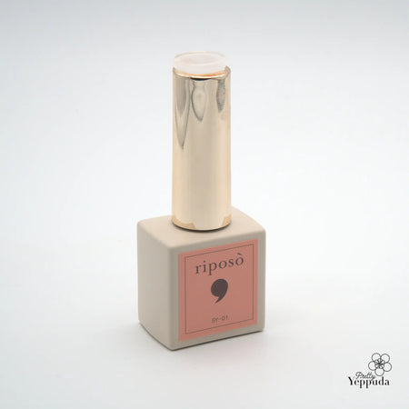 The image depicts a Riposo Love Love Syrup A Set, consisting of a 5-piece non-wipe syrup gel collection in a limited edition. The product features a sleek, minimalist design with a metallic, cylindrical bottle and a square-shaped package in a soft, pastel pink color. This introo volume A of the Riposo syrup gel series offers a range of sheer, nude nail shades that are designed to provide a perfect, natural-looking finish.