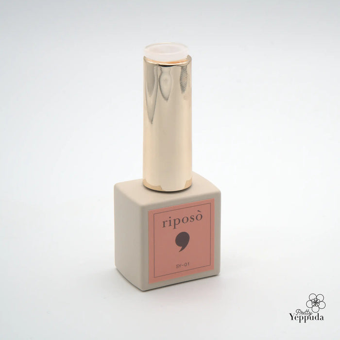 The image depicts a Riposo Love Love Syrup A Set, consisting of a 5-piece non-wipe syrup gel collection in a limited edition. The product features a sleek, minimalist design with a metallic, cylindrical bottle and a square-shaped package in a soft, pastel pink color. This introo volume A of the Riposo syrup gel series offers a range of sheer, nude nail shades that are designed to provide a perfect, natural-looking finish.