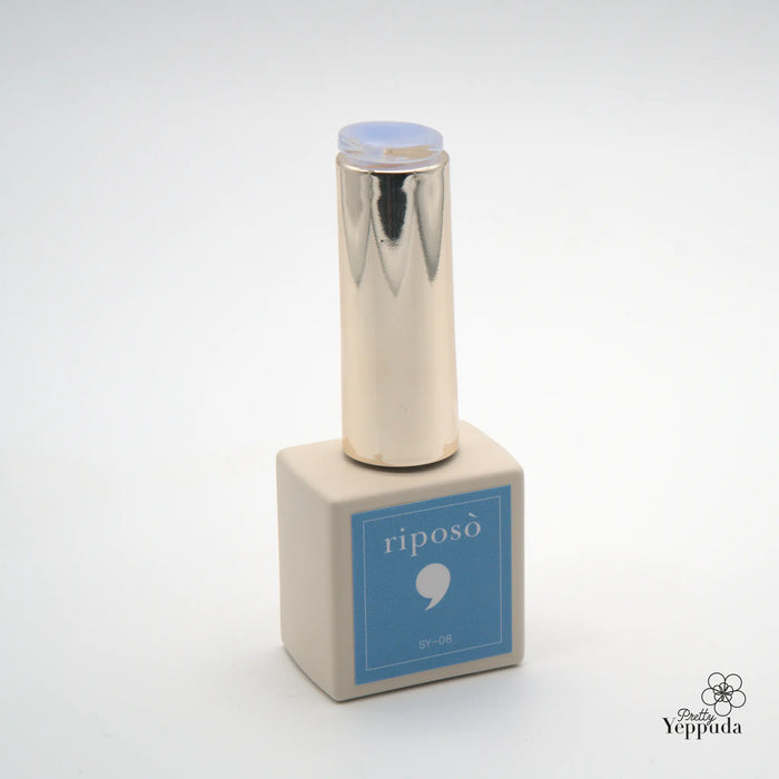 A shiny metallic bottle with a blue label displaying the "RIPOSO" brand name, containing a series of colorful syrup gels formulated for chrome application without the need for a top coat, available in a set or as individual shades, allowing for customization of sheer, cool-toned nail looks.