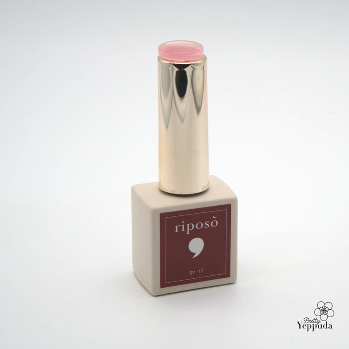 This image depicts a cosmetic product from the Riposo Love Love Syrup D Set, a collection of 5 cult-favorite lip colors with a soft, slightly clear and transparent lip glow effect. The product features a metallic silver container with a pink cap, allowing the varied intensity of the colors to be showcased. The image highlights the quality and unique formulation of this Shopify product, designed to provide a wet-lips look with the ability to layer