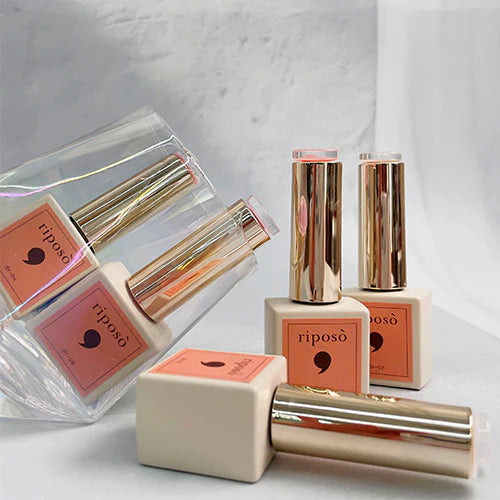 A set of five RIPOSO Love Love Syrup gel nail polish bottles in various nude and sheer shades, packaged in sleek metallic gold and pink containers, creating a visually appealing and high-quality cosmetic product for the Shopify platform.