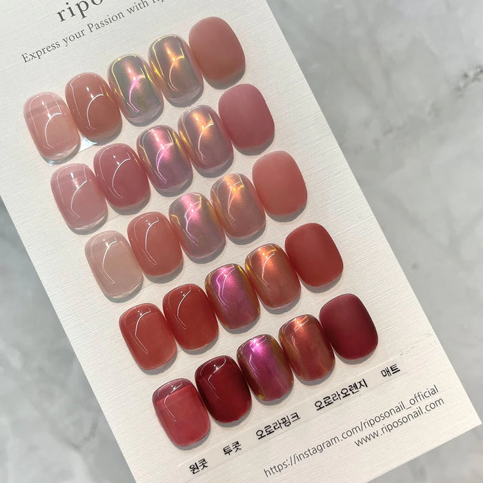 The image shows a display of different nail polish colors from the "RIPOSO Love Love Syrup D Set" collection. The alt text could be: Vibrant and versatile nail polish colors in the RIPOSO Love Love Syrup D Set, featuring a range of shades from nude to deep red that transform with layering for a personalized look.