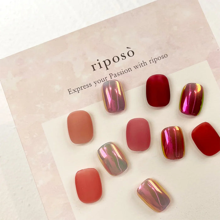 Vibrant and alluring nail polish set featuring a range of red, pink, and metallic colors that transform with varying application, capturing the essence of the Riposo Love Love Syrup D Collection.