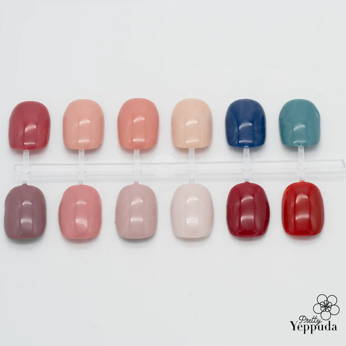 Beautifully arranged nail gel samples showcasing a diverse range of natural, classic, and versatile colors from the Show Me Korea Edge Collection. This premium nail care brand offers high-pigmentation gels that deliver stunning results with just one stroke, perfect for creating elegant and timeless nail looks.