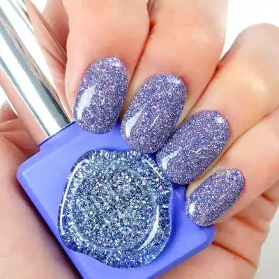 Sparkling gel nail polish in a vibrant purple color, showcasing a dazzling, glitter-infused finish that catches the light beautifully. The image highlights the shimmering, high-shine formula of the Show Me Korea Kitsch Collection, creating a visually captivating and eye-catching display for this Shopify product.