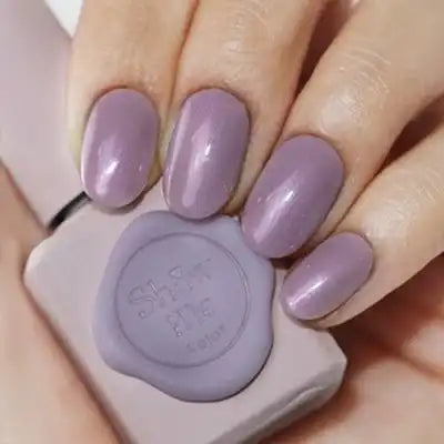 Soft, elegant lilac nail polish bottles from the Yeori Yeori Collection by the acclaimed Korean beauty brand Show Me Korea, showcasing their innovative syrup-like gel formula with a subtle pearlescent sheen.