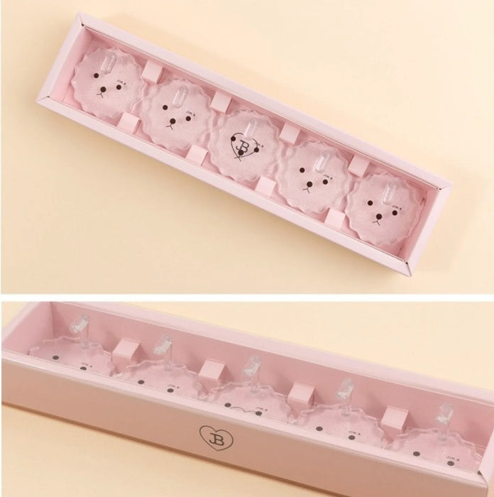 A pink nail tip stand displaying multiple sets of nail tips in a neat, organized arrangement. The image showcases the Jin.B brand's distinctive pink packaging and is designed to help nail artists practice and create their favorite nail designs.