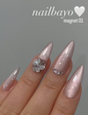 Detailed alt text for the image of the Nailbayo DOI Magnet Gel #1 - 10ml product:

Elegant and intricate nail art adorned with the Nailbayo Magnet Gel #01, a premium Korean nail product featuring a stunning floral design accented by sparkling rhinestones. The nails showcase a lustrous, metallic pink finish that shimmers under the light, creating a captivating and visually striking appearance. This specialized gel formula requires the use of a mag