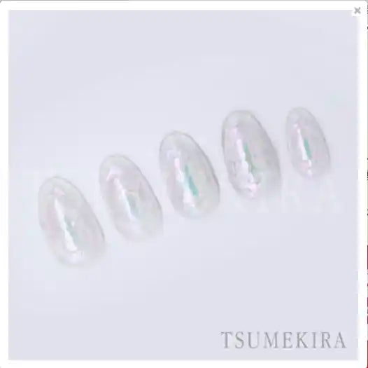 A shimmering collection of round, iridescent seals in a soft, pastel color palette, showcasing the innovative Tsumekira brand's signature aurora-inspired design. These captivating seals emit a mesmerizing glow when embedded, capturing the enchanting beauty of the northern lights.