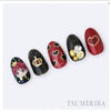 Elaborative alt text for the Tsumekira SG-YRK-001 Yuri Joba x Crown Shopify product image: Artistic nail art designs featuring an array of intricate gold foil crowns, ribbons, and heart-shaped silhouettes in vibrant red, black, and white colors. The meticulously crafted details evoke a whimsical, feminine aesthetic that perfectly complements the Tsumekira brand's signature style.