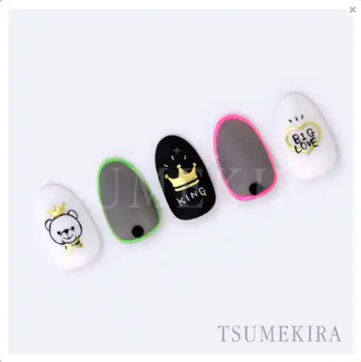 Decorative nail art set featuring colorful crown, ribbon, and heart silhouette designs in gold foil by the Japanese nail art brand Tsumekira.