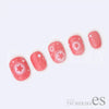 A close-up view of five pink acrylic nails adorned with delicate sakura flower decals and polka dot patterns, showcasing the Tsumekira AIRY CHEEK SAKURA ES-ACH-005 Shopify product's elegant and intricate nail art design.