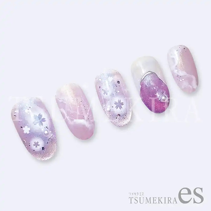 Elegant Tsumekira AIRY CHEEK SAKURA ES-ACH-005 nails with delicate floral designs, showcasing a sophisticated and feminine aesthetic. The nails feature a gradient of pastel pink and purple hues, accentuated by subtle sparkles, creating a visually captivating and on-trend look for Tsumekira brand's nail art products.