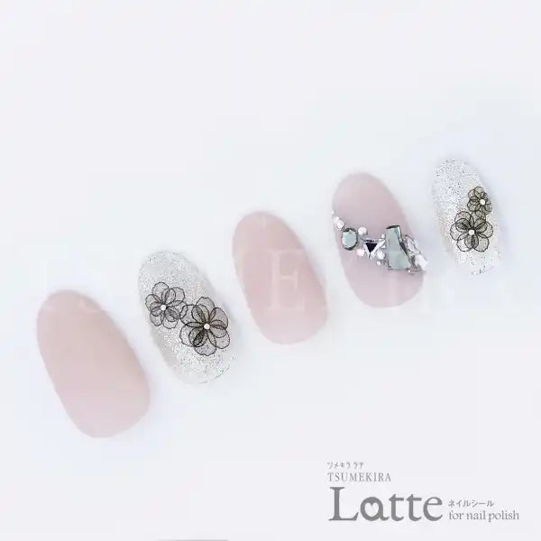 Elegant and delicate Japanese nail art stickers in a soft pastel color palette, featuring floral designs and a glossy finish for a sophisticated and stylish nail look. The stickers are perfect for creating beautiful, trendy nail art with minimal effort, making them ideal for busy professionals or those seeking a quick nail transformation. The Tsumekira Latte collection offers a beautiful and on-trend way to accessorize nails with its high-quality