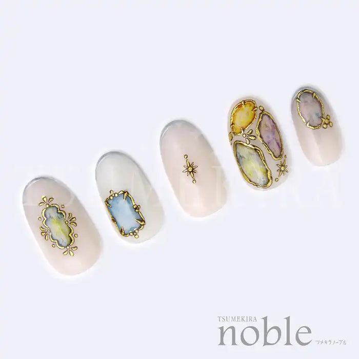 Decorative jewel-encrusted nail art stickers in a variety of colorful shapes and designs, showcasing the luxurious NOBLE JEWELRY collection by the Tsumekira brand. These statement nail accessories are designed for easy application over gel manicures, allowing users to effortlessly achieve intricate and glamorous nail art.