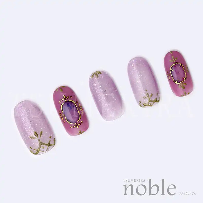 Elegant and ornate nail art stickers featuring gold-edged jewels on a soft pink backdrop, allowing for easy creation of luxurious, jewel-inspired nail designs. Tsumekira NOBLE JEWELRY's NO-JEW-101 collection offers a high-quality, versatile nail art solution for gel manicures.