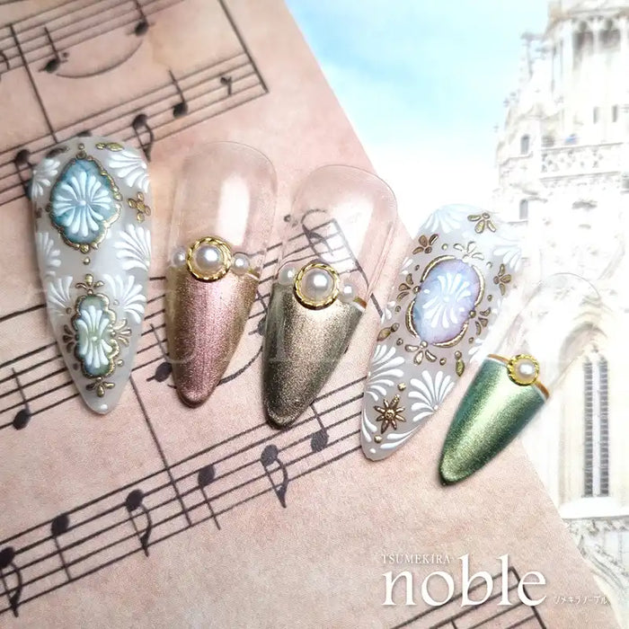 Elegant nail art designs featuring ornate jewelry-inspired embellishments in gold and silver tones, adorned with gemstones and floral motifs, showcased on a musical background, capturing the essence of the Tsumekira NOBLE JEWELRY NO-JEW-101 product.