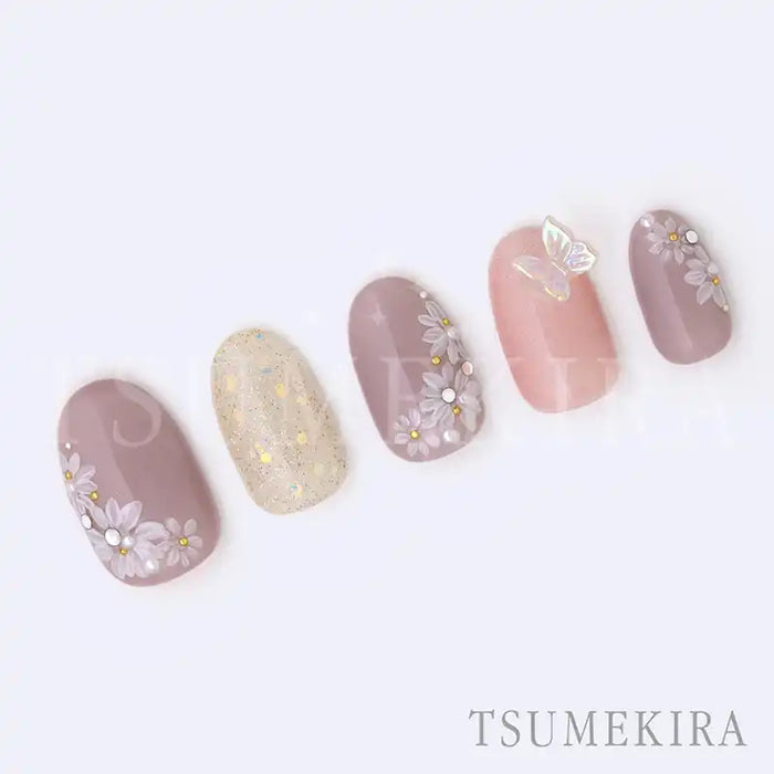 Elegant and delicate floral nail art design featuring Tsumekira YUMI × MAGARET nail stickers. The design showcases beautiful white flowers accented with sparkling details, creating a serene and seasonless aesthetic suitable for any occasion. The high-quality Tsumekira brand nail products offer a sophisticated and visually appealing nail art solution.