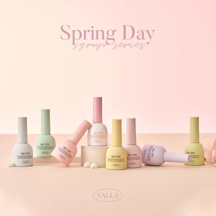 Vibrant, pastel-colored nail polish bottles and jars displayed on a pink background, showcasing the VALLA Spring Day Collection. This elaborate ALT text captures the essence of the product line, highlighting the vivid spring-inspired colors and the essence of the seasonal collection.