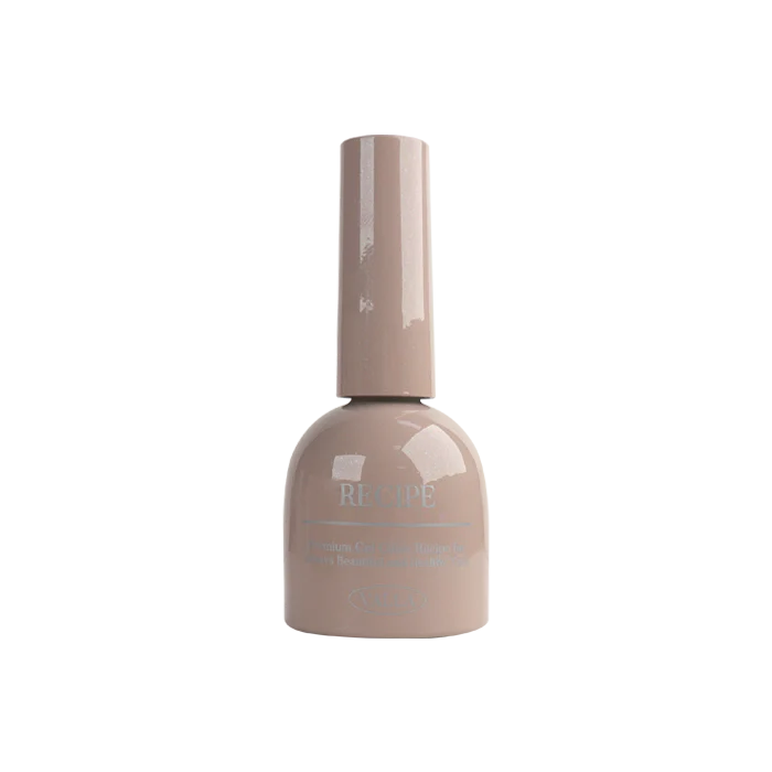 A close-up view of a beige bottle of VALLA's new magnetic gel polish from their Dewy Collection, featuring a sleek and trendy design with a smooth, glossy finish. The bottle prominently displays the VALLA brand name, highlighting the high-quality and innovative nature of this magnetic gel polish product.